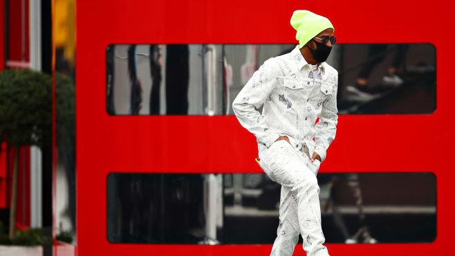 Lewis Hamilton Wears Louis Vuitton Souvenir Jacket and Sneakers at